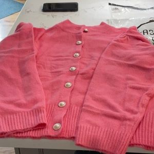 Beautiful bright pink cardigan with white pearl buttons . Never worn , new
